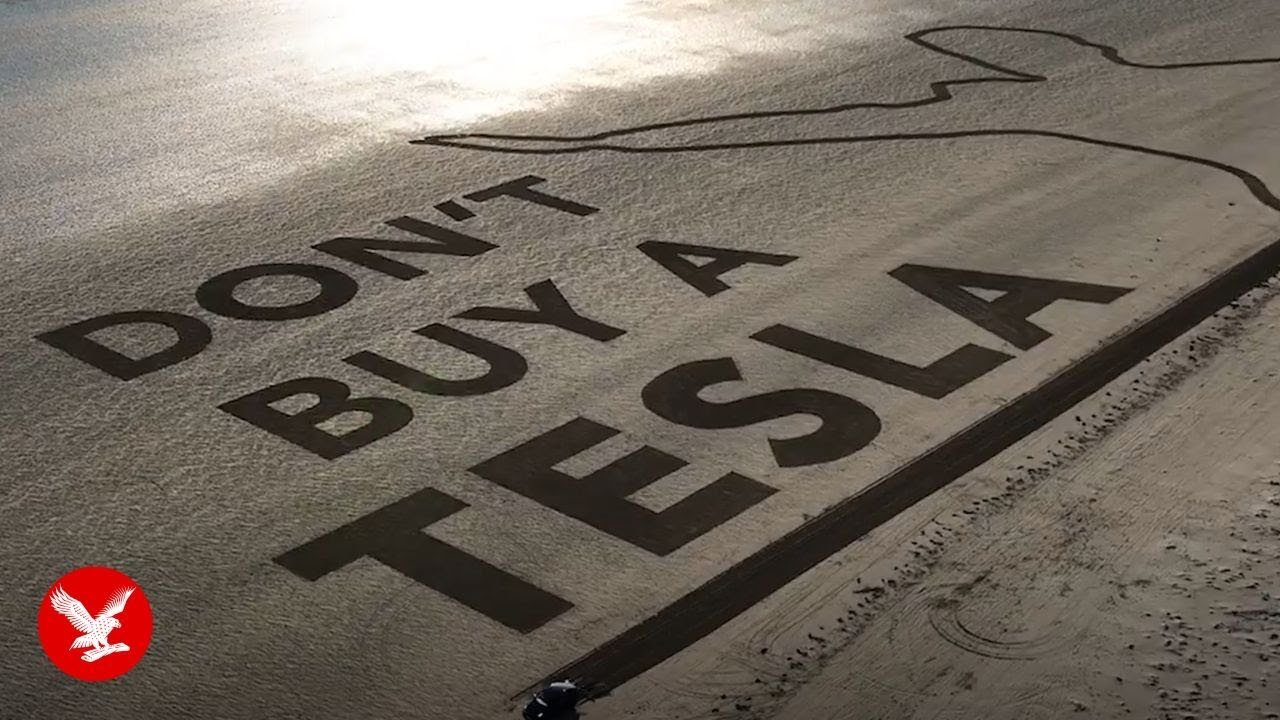 Elon Musk ‘salute’ carved into sand in world’s largest Tesla protest